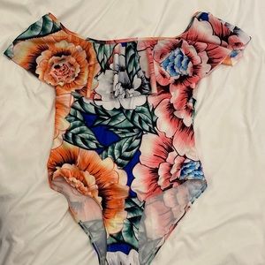 Off the shoulder floral one piece bathing suit. Extremely flattering!
